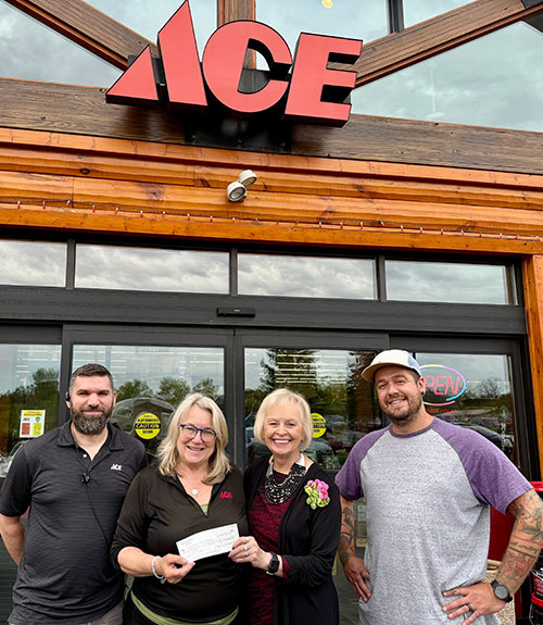 Waushara Food Pantry Executice Director and Board Member receiving donation check from Ace Hardware